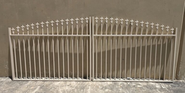 Fleur-de-Lis arched top swing gates custom fabricated