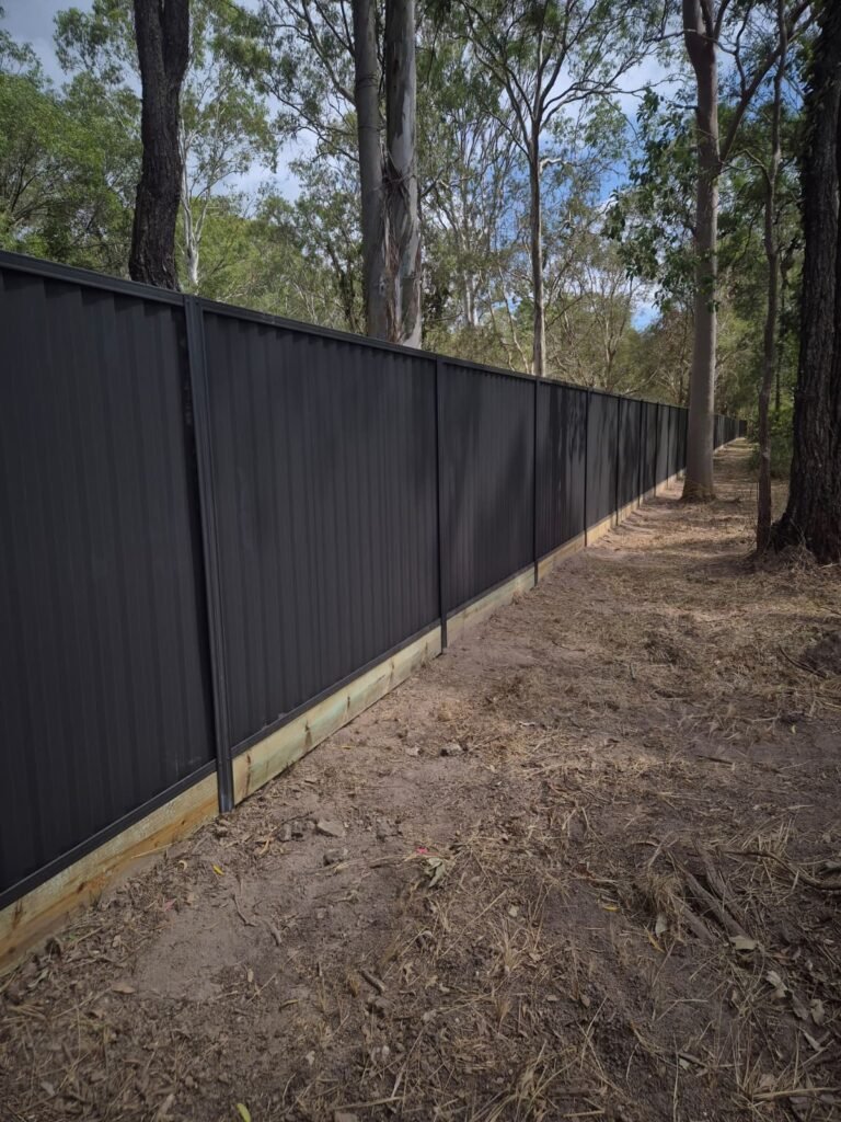 GramLine SawTooth ZigZag fence in Coke colour, installed boundary