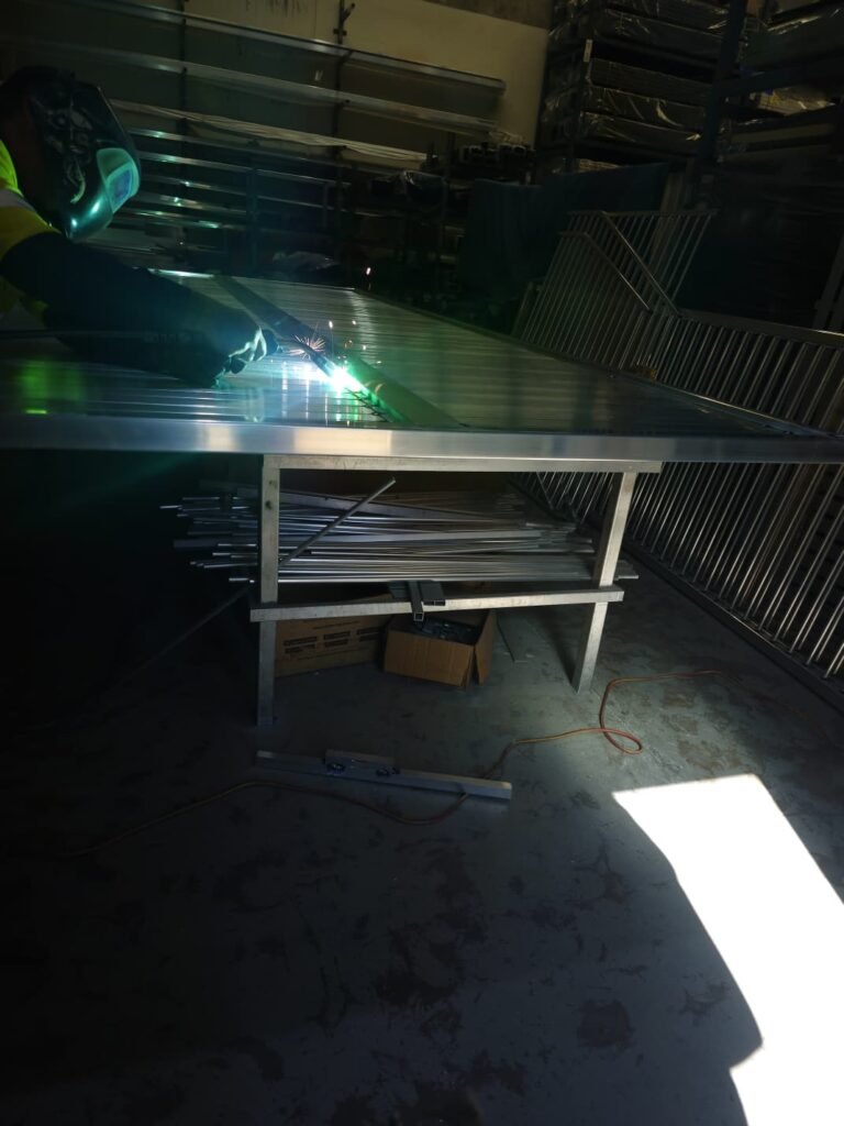 Welding a custom slat gate in the Deception Bay workshop