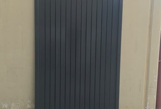 Custom vertical slat gate with 6mm gap in Coke and Monument colours