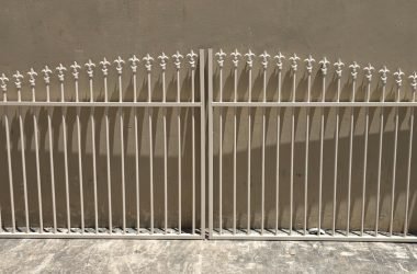 Fleur-de-Lis arched top swing gates custom fabricated
