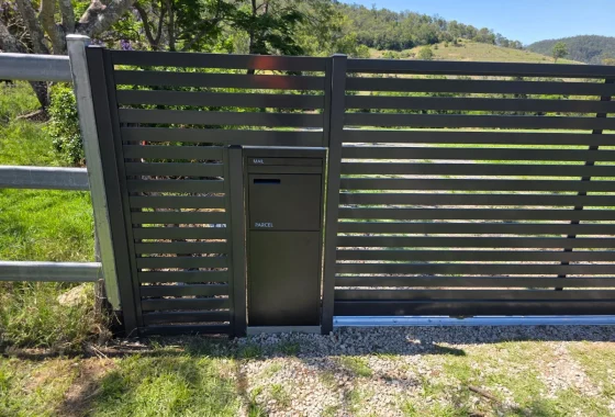 Horizontal slat fence panel with built-in letterbox